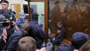 Darya Trepova, who is suspected of the killing of Russian military blogger Maxim Fomin widely known by the name of Vladlen Tatarsky, sits in an enclosure for defendants during a court hearing in Moscow, Russia, April 4, 2023. REUTERS/Evgenia Novozhenina