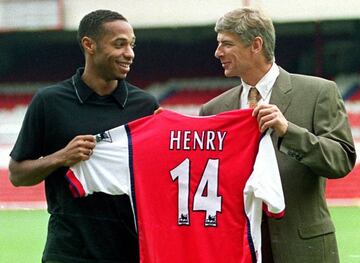 Thierry Henry (left) poses with Arsene Wenger after signing for Arsenal in 1999.