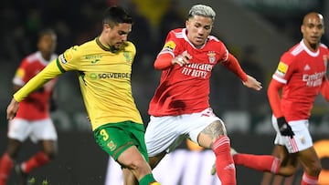 Pacos de Ferreira's Portuguese defender Nuno Lima (L) fights for the ball with Benfica's Argentine midfielder Enzo Fernandez during the Portuguese league football match between FC Pacos de Ferreira and SL Benfica, at the Capital do Movel stadium in Pacos de Ferreira on January 26, 2023. (Photo by MIGUEL RIOPA / AFP)