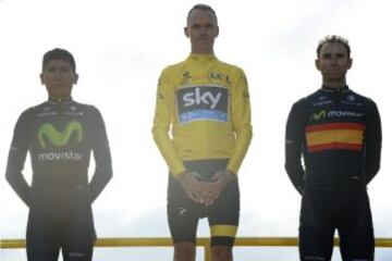 Tour de France 2015's winner Great Britain's Christopher Froome (C), second-placed Colombia's Nairo Quintana (L) and third-placed Spain's Alejandro Valverde (C) celebrate on the podium on the Champs-Elysees avenue, at the end of the 109,5 km twenty-first and last stage of the 102nd edition of the Tour de France cycling race on July 26, 2015, between Sevres and Paris.  AFP PHOTO / JEFF PACHOUD