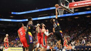 PHOENIX, ARIZONA - APRIL 17: Cameron Johnson #23 of the Phoenix Suns lays up a shot against the New Orleans Pelicans during the first half of Game One of the Western Conference First Round NBA Playoffs at Footprint Center on April 17, 2022 in Phoenix, Arizona. NOTE TO USER: User expressly acknowledges and agrees that, by downloading and or using this photograph, User is consenting to the terms and conditions of the Getty Images License Agreement.   Christian Petersen/Getty Images/AFP
 == FOR NEWSPAPERS, INTERNET, TELCOS &amp; TELEVISION USE ONLY ==