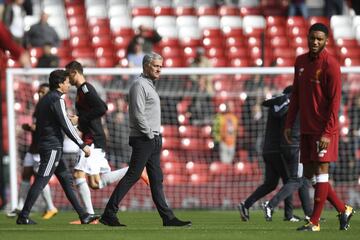 Manchester United's Jose Mourinho inspects the pitch ahead of the game at Anfield.