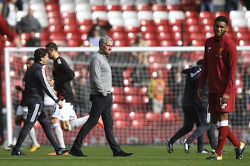 Manchester United's Jose Mourinho inspects the pitch ahead of the game at Anfield.