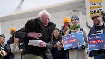 U.S. Senator Bernie Sanders (I-VT) hugs a supporter of student loan debt relief in front of the Supreme Court as the justices are scheduled to hear oral arguments in two cases involving President Joe Biden's bid to reinstate his plan to cancel billions of dollars in student debt in Washington, U.S., February 28, 2023. REUTERS/Nathan Howard