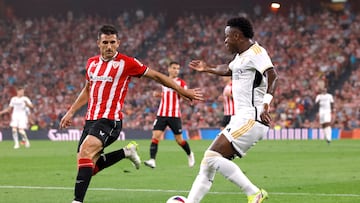 Soccer Football - Spain - LaLiga - Athletic Bilbao v Real Madrid - San Mames, Bilbao, Spain - August 12, 2023 Real Madrid's Vinicius Junior in action with Athletic Bilbao's Dani Vivian REUTERS/Vincent West