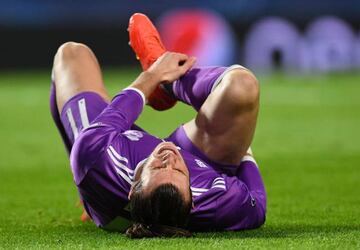 Still out: Real Madrid's Welsh forward Gareth Bale grimaces as he lies on the pitch during the UEFA Champions League game against Sporting CP in November 2016.