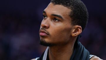 San Antonio Spurs' French forward-center #01 Victor Wembanyama rests on the bench during the NBA preseason game between the San Antonio Spurs and Golden State Warriors at Chase Center in San Francisco, California on October 20, 2023. (Photo by Loren Elliott / AFP)