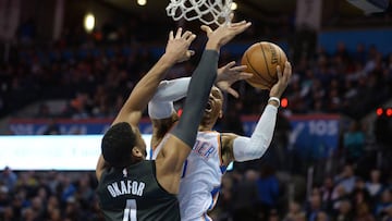 Jan 23, 2018; Oklahoma City, OK, USA; Oklahoma City Thunder guard Russell Westbrook (0) drives to the basket in front of Brooklyn Nets center Jahlil Okafor (4) during the second quarter at Chesapeake Energy Arena. Mandatory Credit: Mark D. Smith-USA TODAY