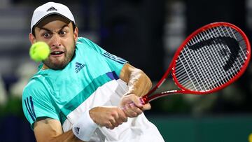 DUBAI, UNITED ARAB EMIRATES - MARCH 20: Aslan Karatsev of Russia plays a backhand return during the men's singles Final match against Lloyd Harris of South Africa during day fourteen of the Dubai Duty Free Tennis at Dubai Duty Free Tennis Stadium on March 20, 2021 in Dubai, United Arab Emirates. (Photo by Francois Nel/Getty Images)