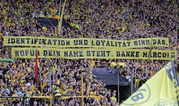 Fans of Dortmund cheer prior to the German Bundesliga soccer match 
