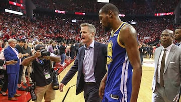 May 6, 2019; Houston, TX, USA; Golden State Warriors head coach Steve Kerr (center) and forward Kevin Durant (35) walk off the court after game four of the second round of the 2019 NBA Playoffs against the Houston Rockets at Toyota Center. Mandatory Credit: Troy Taormina-USA TODAY Sports