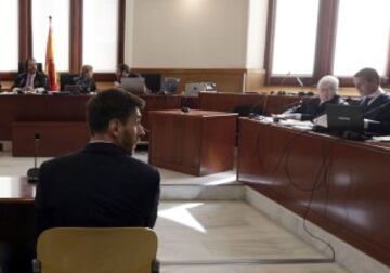 Leo Messi sits in Barcelona's high court room.