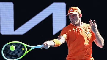 Spain's Alejandro Davidovich Fokina hits a return to USA�s Reilly Opelka during their men's singles match on day four of the Australian Open tennis tournament in Melbourne on January 21, 2026. (Photo by Izhar Khan / AFP) / -- IMAGE RESTRICTED TO EDITORIAL USE - STRICTLY NO COMMERCIAL USE --