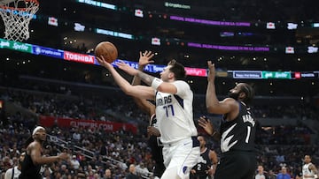 Apr 23, 2024; Los Angeles, California, USA; Dallas Mavericks guard Luka Doncic (77) shoots the ball against Los Angeles Clippers guard James Harden (1) during the third quarter of game two of the first round for the 2024 NBA playoffs at Crypto.com Arena. Mandatory Credit: Kiyoshi Mio-USA TODAY Sports