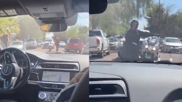 Un policia intenta detener un auto con el modo de conducción autónomo