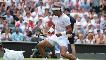 Spain's Rafael Nadal celebrates a point against Kazakhstan's Mikhail Kukushkin in their men's singles second round match on the fourth day of the 2018 Wimbledon Championships at The All England Lawn Tennis Club in Wimbledon, southwest Londo