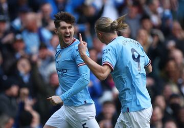 John Stones (left), Haaland (right) celebrate the stunning volley scored by the Yorkshireman.