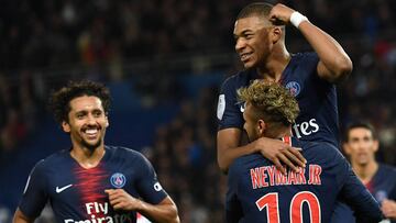 Paris Saint-Germain&#039;s French forward Kylian Mbappe (C) celebrates with Paris Saint-Germain&#039;s Brazilian forward Neymar (R) and Paris Saint-Germain&#039;s Brazilian defender Marquinhos after he scored a goal during the French L1 football match bet