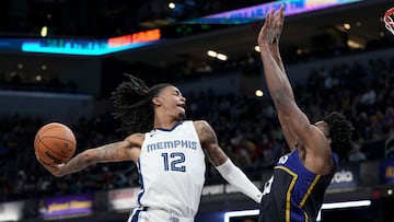 INDIANAPOLIS, INDIANA - JANUARY 14: Ja Morant #12 of the Memphis Grizzlies dunks the ball over Jalen Smith #25 of the Indiana Pacers in the third quarter at Gainbridge Fieldhouse on January 14, 2023 in Indianapolis, Indiana. NOTE TO USER: User expressly acknowledges and agrees that, by downloading and or using this photograph, User is consenting to the terms and conditions of the Getty Images License Agreement.   Dylan Buell/Getty Images/AFP (Photo by Dylan Buell / GETTY IMAGES NORTH AMERICA / Getty Images via AFP)