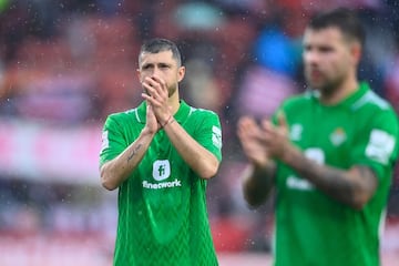 Real Betis' Argentinian midfielder #05 Guido Rodriguez reacts at the end of the Spanish league football match between Girona FC and Real Betis at the Montilivi stadium in Girona on March 31, 2024. (Photo by PAU BARRENA / AFP)