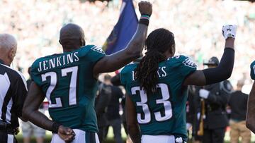 Sep 25, 2016; Philadelphia, PA, USA; Philadelphia Eagles strong safety Malcolm Jenkins (27) and defensive back Ron Brooks (33) hold up fists during the national anthem before action against the Pittsburgh Steelers at Lincoln Financial Field. Mandatory Credit: Bill Streicher-USA TODAY Sports ORG XMIT: USATSI-268310 ORIG FILE ID:  20160925_gma_sq4_066.jpg
