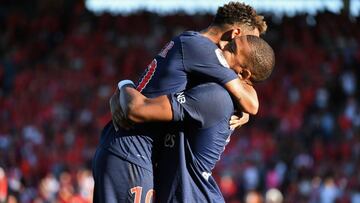 Paris Saint-Germain's French forward Kylian Mbappe (R) celebrates with Paris Saint-Germain's Brazilian forward Neymar after scoring their third goal during the French L1 football match between Nimes and Paris Saint-Germain (PSG), on September 1,