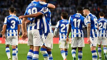 Real Sociedad's Norwegian forward Alexander Sorloth (L) celebrates with Real Sociedad's Spanish midfielder Brais Mendez after scoring his team's second goal during the Spanish League football match between Real Sociedad and CA Osasuna at the Anoeta stadium in San Sebastian on December 31, 2022. (Photo by ANDER GILLENEA / AFP) (Photo by ANDER GILLENEA/AFP via Getty Images)