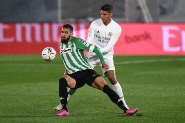 Raphael Varane in action against Borja Iglesias of Real Betis on Saturday, 24 April.