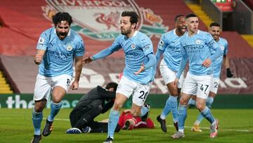 07 February 2021, United Kingdom, Liverpool: Manchester City's Ilkay Gundogan (L) celebrates scoring his side's first goal during the English Premier League soccer match between Liverpool and Manchester City at Anfield. Photo: Jon Super/PA Wire/