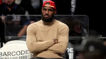 Mar 10, 2025; Brooklyn, New York, USA; Los Angeles Lakers forward LeBron James (23) watches from the bench during the fourth quarter against the Brooklyn Nets at Barclays Center. Mandatory Credit: Brad Penner-Imagn Images