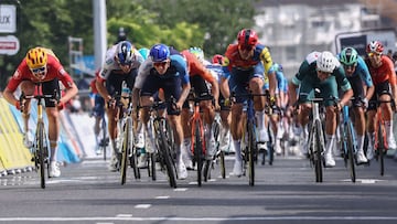 Israel - Premier Tech's British rider Thomas Jake Stewart (C) cycles to the finish line to win the 5th stage of the 77th edition of the Criterium du Dauphine cycling race, 183 km between Saint-Priest and M�con, on June 12, 2025. (Photo by Anne-Christine POUJOULAT / AFP)
