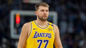 Apr 25, 2025; Minneapolis, Minnesota, USA; Los Angeles Lakers guard Luka Doncic (77) looks on against the Minnesota Timberwolves in the first half during game three of first round for the 2024 NBA Playoffs at Target Center. Mandatory Credit: Jesse Johnson-Imagn Images