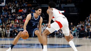 Feb 5, 2023; Memphis, Tennessee, USA; Memphis Grizzlies forward Santi Aldama (7) dribbles as Toronto Raptors forward Scottie Barnes (4) defends during the second half at FedExForum. Mandatory Credit: Petre Thomas-USA TODAY Sports