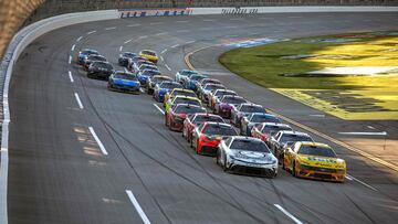 TALLADEGA, ALABAMA - APRIL 21: Tyler Reddick, driver of the #45 Jordan Brand Toyota, and Michael McDowell, driver of the #34 Love's Travel Stops Ford, lead the field during the NASCAR Cup Series GEICO 500 at Talladega Superspeedway on April 21, 2024 in Talladega, Alabama.   Sean Gardner/Getty Images/AFP (Photo by Sean Gardner / GETTY IMAGES NORTH AMERICA / Getty Images via AFP)