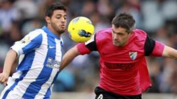 <b>PARTIDAZO. </b>Carlos Vela, autor de la chilena que supuso el 2-2, pugna con Toulalan por un balón. El francés fue de los mejores del Málaga ayer en Anoeta.