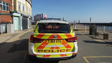 WHITBY, UNITED KINGDOM - APRIL 05: Police officers from North Yorkshire Police maintain a presence on the streets of Whitby as visitors observe the guidelines during the Coronavirus pandemic lockdown on April 05, 2020 in Whitby, United Kingdom. The Corona