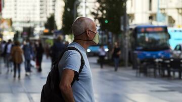 MADRID, SPAIN - SEPTEMBER 29: A man looks around the Gran Via street on September 29, 2020 in Madrid, Spain. The iconic street of Gran Via, the busiest in Spain and the third in Europe, hosts a lot of theatres, cinemas, souvenir stores and restaurants. Many of them are still closed, more than six months after the coronavirus outbreak hit Madrid. (Photo by Carlos Alvarez/Getty Images)