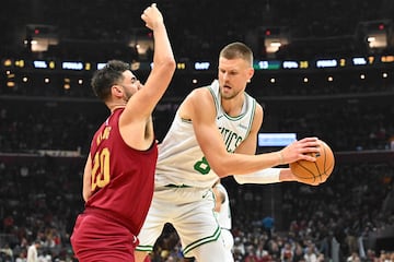 Niang of the Cavaliers guards Kristaps Porzingis of the Celtics.