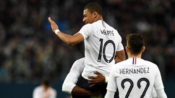 France&#039;s forward Kylian Mbappe celebrates after scoring a goal during an international friendly football match between Russia and France at the Saint Petersburg Stadium in Saint Petersburg on March 27, 2018. / AFP PHOTO / FRANCK FIFE