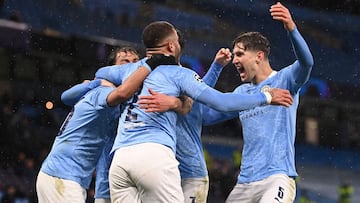 MANCHESTER, ENGLAND - MAY 04: Riyad Mahrez of Manchester City (obscure) celebrates with Kyle Walker and John Stones after scoring his team&#039;s second goal during the UEFA Champions League Semi Final Second Leg match between Manchester City and Paris Sa