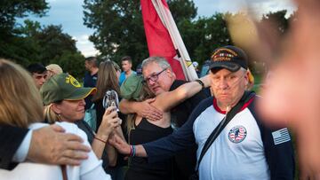 Veterans emotionally embrace during a news conference, following the completion of a vote on the Promise to Address Comprehensive Toxics (PACT) Act on Capitol Hill.