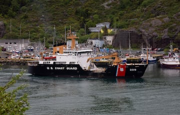 A U.S. Coast Guard ship arrives in the harbor of St. John's Newfoundland on Wednesday, June 28, 2023, following the arrival of the ship Horizon Arctic carrying debris from the Titan submersible. The submersible owned by OceanGate Expeditions imploded on its way to the wreck of the Titanic. (Paul Daly/The Canadian Press via AP)