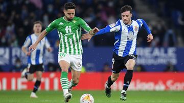BARCELONA, SPAIN - JANUARY 21: Alex Moreno of Real Betis battles for the ball with Javi Puado of Espanyol during the La Liga Santander match between RCD Espanyol and Real Betis at RCDE Stadium on January 21, 2022 in Barcelona, Spain. (Photo by Alex Caparr