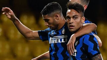 Inter Milan&#039;s Argentine forward Lautaro Martinez (R) celebrates with Inter Milan&#039;s Moroccan defender Achraf Hakimi after scoring his team&#039;s fifth goal during the Italian Serie A football match Benevento vs Inter on September 30, 2020 at the