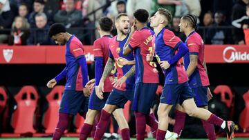 Barcelona's Spanish midfielder #16 Fermin Lopez (2R) celebrates scoring his team's second goal during the Spanish league football match between Sevilla FC and FC Barcelona at Ramon Sanchez Pizjuan Stadium in Seville on February 9, 2025. (Photo by CRISTINA QUICLER / AFP)