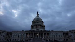 The sun sets behind the U.S. Capitol building in Washington.