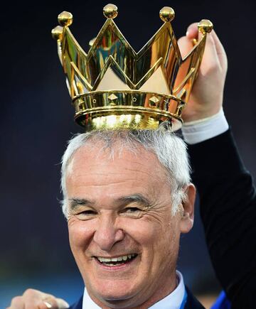 Claudio Ranieri Manager of Leicester City poses with the crown of the Premier League Trophy.