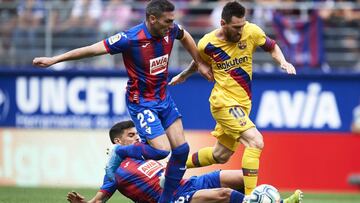 EIBAR, SPAIN - OCTOBER 19: Lionel Messi of FC Barcelona competes for the ball with Anaitz Arbilla and Sergio Alvarez of SD Eibar during the Liga match between SD Eibar SAD and FC Barcelona at Ipurua Municipal Stadium on October 19, 2019 in Eibar, Spain. (