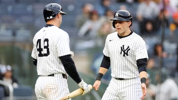 NEW YORK, NEW YORK - APRIL 12: Ben Rice #22 reacts with Paul Goldschmidt #48 of the New York Yankees after scoring on a RBI single hit by Cody Bellinger #35 (not pictured) during the fifth inning against the San Francisco Giants at Yankee Stadium on April 12, 2025 in the Bronx borough of New York City. Sarah Stier/Getty Images/AFP (Photo by Sarah Stier / GETTY IMAGES NORTH AMERICA / Getty Images via AFP)