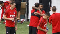 Augusto greets his team mates on Atlético's first day back.